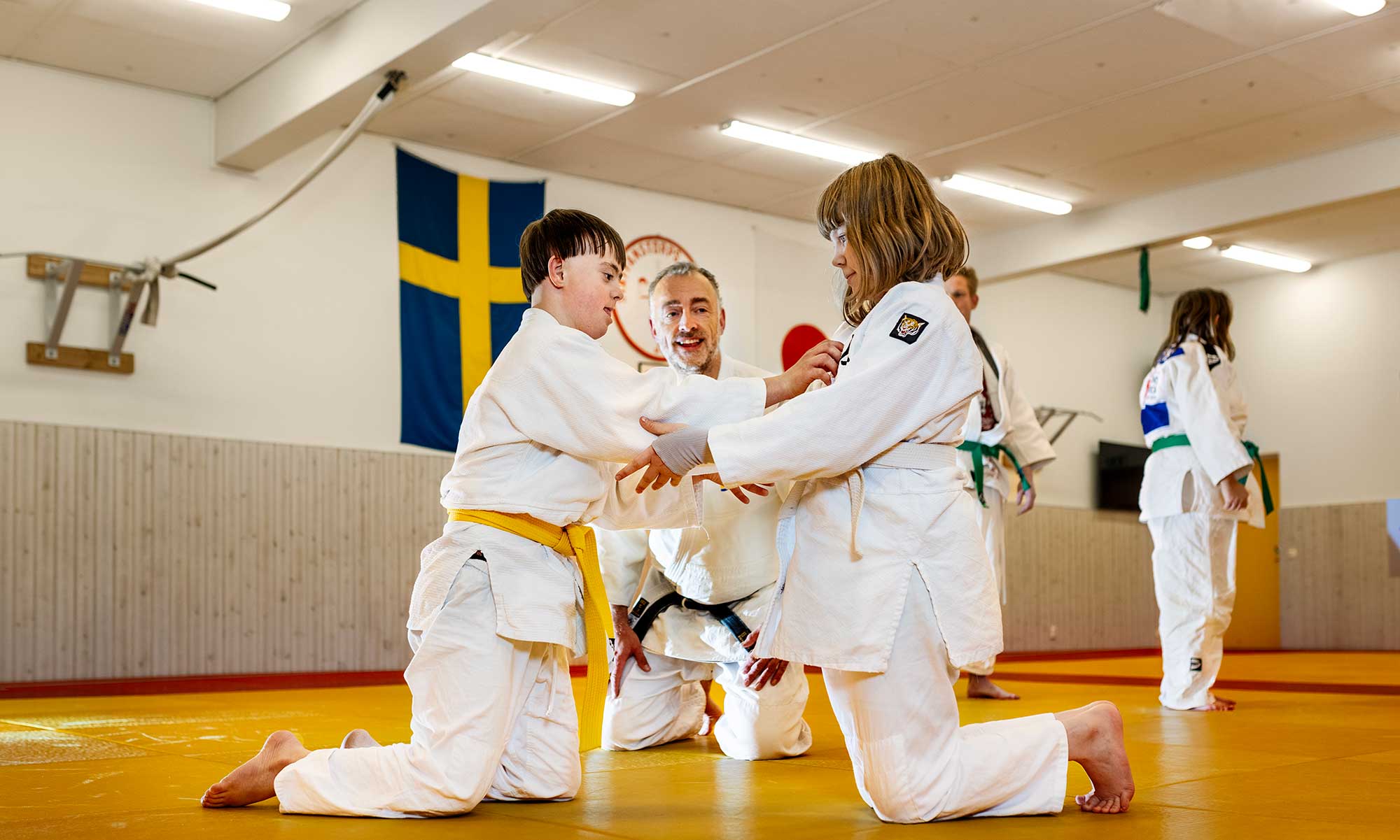 Children practice judo.
