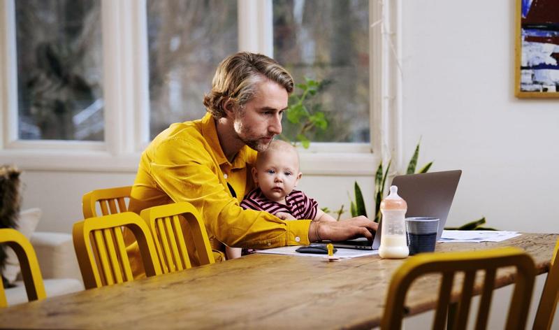 Father and baby with a laptop