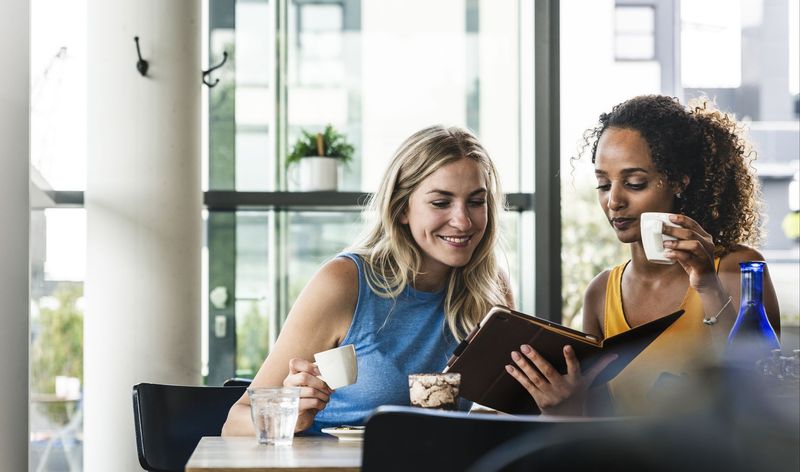 Two young women in a coffee shop